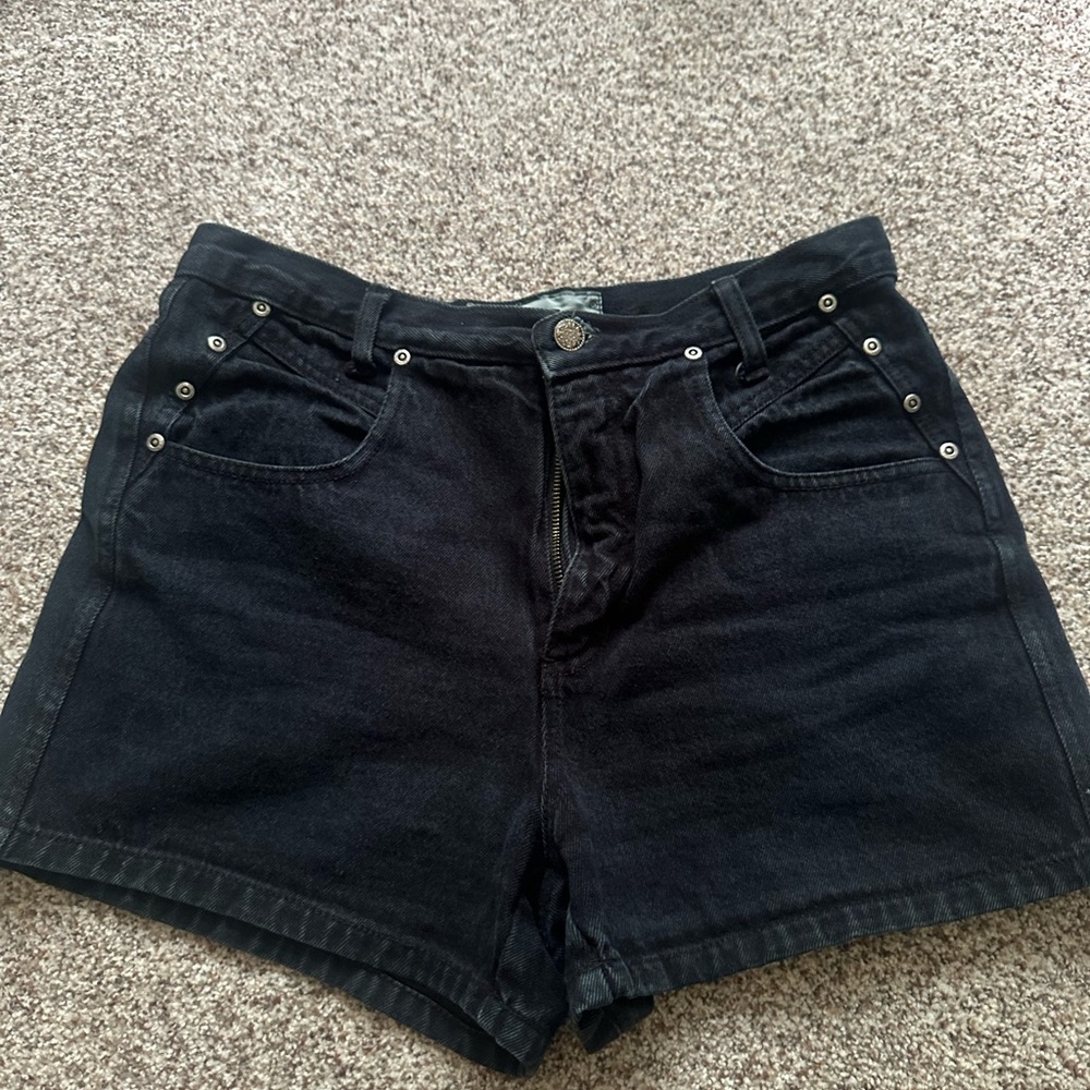 Vintage black denim shorts with grommet button detailing